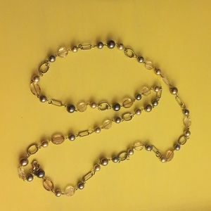 Necklace with silver and champagne accents.